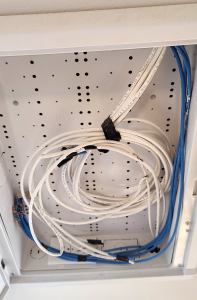 Open media panel with coiled wires.